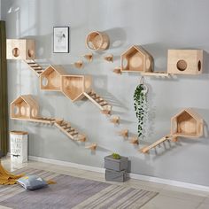 a living room filled with lots of wooden shelves and decorations on the wall next to a window