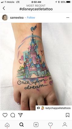 someone has a tattoo on their foot that says, once upon a dream and the castle is