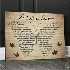 a wooden sign with the words as i sit in heaven written on it and butterflies flying around