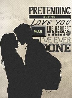 the silhouette of a man and woman kissing in front of a poster with words on it