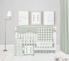 a baby's nursery room with green and white checkered crib bedding