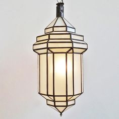 a light hanging from the ceiling in a room