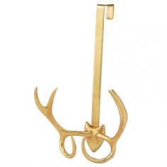 a pair of deer's antlers hang from a hook on a white background