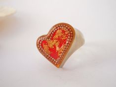 "Unique heart statement ring. Large boho ring. Gold & red resin heart ring on a sterling silver base. Heart chunky ring. This unique red heart ring makes a sweet reminder of your favorite things in your life. It's a trendy, fashionable way to make a statement, keeps your look feminine and stylish. Great for everyday wear, and will be a stunning addition to any evening dress. A meaningful gift for mom, sister or a friend, to let them know how much you love them. This heart ring has a beautifu Unique Handmade Heart Ring As Gift, Unique Handmade Heart Ring Gift, Unique Handmade Heart Ring For Gift, Handmade Red Heart-shaped Rings, Handmade Bohemian Heart-shaped Rings, Bohemian Heart-shaped Rings For Gifts, Bohemian Handmade Heart Ring Gift, Unique Heart Ring For Valentine's Day, Handmade Bohemian Heart Ring Gift