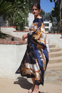 Beautiful navy and white designer print silk caftan. I'ts elegance will take you to any occasion.  One size.  Fits small to extra large sizes.  The width is 52 inches, edge to edge, 104 around the body.  The side seams are 6 inches from the edge.  The length is 50 inches.  Machine was on a delicate cycle for short time., Elegant Printed Maxi Dress For Vacation, Elegant Flowy Kaftan For Vacation, Elegant Silk Kaftan For Vacation, Elegant Vacation Kaftan With Kimono Sleeves, Elegant Maxi Dress With Kimono Sleeves For Vacation, Elegant Printed Beach Kaftan, Elegant Beach Kaftan With Kimono Sleeves, Elegant Long Kaftan For Vacation, Chic White Kaftan With Kimono Sleeves