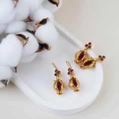 We produce our  jewelery in Istanbul. We use semi precious gemstones and brass covered with 18k-24k  gold. Their nature may cause gemstones to be in different shapes and color.   Do not forget to explore more pieces using the link below. https://www.etsy.com/shop/FndJewelry   THANK YOU🤍 We are so grateful you have chosen FndJewelry.     We love sharing happiness with you, it is only real when shared! Pommegranate Necklace, Pomegranate Seed Jewelry, Pomegranate Gold Jewelry, Pomegranate Beads, Pomegranate Pendant, Pomegranate Earrings, Pomegranate Jewelry, Pomegranate, Semi Precious Gemstones