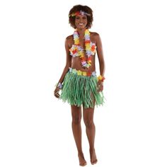 a woman in a grass skirt and flower lei