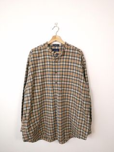 Vintage Beige/Navy Blue Plaid Collarless Flannel Pullover/Shirt. Measurements Length: 34" Armpit to armpit: 28 1/2" Armpit to end of sleeve: 20 1/2" Condition: Gently used. There's no stains or holes. Good condition. ※Please read the policy before you purchase※ Long Sleeve Plaid Tops For Daywear, Plaid Long Sleeve Shirt For Daywear, Collared Plaid Tops For Daywear, Plaid Collared Top For Daywear, Oversized Plaid Top For Daywear, Classic Plaid Tops For Daywear, Classic Long Sleeve Plaid Tops, Beige Plaid, Pullover Shirt