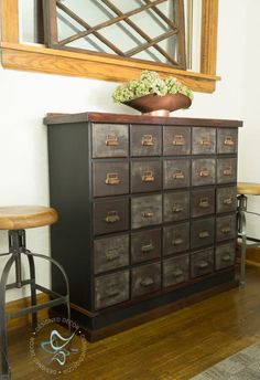 an old dresser with lots of drawers underneath a mirror