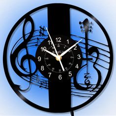 a black clock with musical notes on it