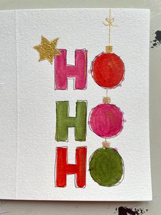 a card with the word ho hoo written in red, green and gold on it