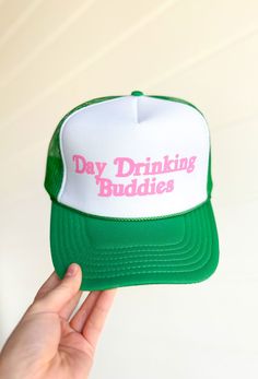 Day Drinking Buddies Trucker Hat, green and white trucker hat with pink font day drinking buddies on the front Green Hat With Letter Print And Curved Bill, Green Curved Bill Hat With Letter Print, Green Dad Hat With Letter Print And Adjustable Fit, Adjustable Green Dad Hat With Letter Print, Green Adjustable Dad Hat With Letter Print, Green Snapback Baseball Cap With Letter Print, Green Snapback Hat With Letter Print, Green Snapback Cap With Letter Print, Green Letter Print Snapback Baseball Cap