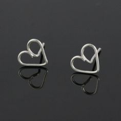 "This unique heart stud earrings are handmade wire wrapped sterling silver. Free US shipping Customers who purchased this item said: \"Very nice. Glad I bought them\" The heart is the ultimate symbol of love. This heart earrings are a perfect gift for the one you love, or for bridesmaid gift, or for birthday gift. We also can customize design for you. The dimension of the earrings is 9mm/3/8inches. ;-) My contact number: 626-379-1904. Please contact me if you would like to order multiples or cus Minimalist Sterling Silver Heart Earrings With Ear Wire, Heart-shaped Metal Earrings For Gifts, Valentine's Day Nickel-free Metal Heart Earrings, Handmade Heart-shaped Sterling Silver Earrings, Heart-shaped Metal Earrings For Valentine's Day, Handmade Wire Wrapped, Handmade Wire, Heart Studs, Handmade Wire Jewelry