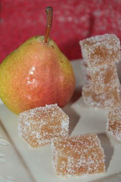 an apple and some sugar cubes on a plate