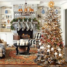 a living room with a christmas tree in the corner and stockings on the fireplace mantel