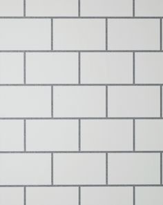 a white brick wall with grey lines on it