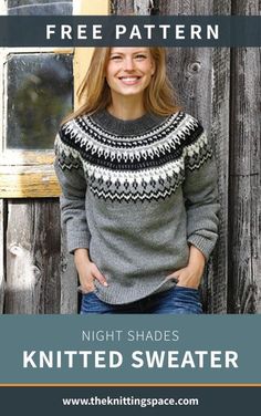 a woman standing in front of a wooden fence wearing a knitted sweater with the text, free pattern night shades knitted sweater