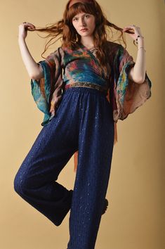 Due to this garment being handmade, please allow up to 7-14 days for this item to be shipped. Effortlessly magic, The Bowie Trousers beckons you to get lost in a bohemian reverie. Ornate and ethereal complete with sequin embroidery, elasticated waist and a cropped length tapered leg fit. Their lightweight feel makes them easy to pair back for summer or dress up with boots and a jacket for a night out under the disco ball. SIZE GUIDE: UK 6 - (WAIST 24", HIPS 40") UK 8 - (WAIST 26", HIPS 40") UK 1 Hippie Style Fall Festival Pants, Hippie Fall Festival Pants, Blue Bohemian Embroidered Pants, Bohemian Blue Embroidered Pants, Bohemian Blue Pants For Fall, Blue Bottoms For Fall Festival, Womens Trousers, Sequin Embroidery, Sequins Embroidery