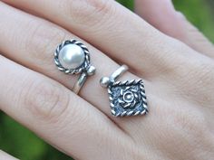 Sterling Silver Ethnic Boho Thumb Adjustable Pearl Spoon Ring, Sun Grunge Ornament White Stone Open Ring, Armenian Jewelry Boho style is a symbiosis of glitz and poverty due to the fact that sometimes incongruous things are combined in clothes. Elements of different cultures harmoniously coexist in it, so this is not just a fashionable direction, it is a whole aesthetic worldview. The girls who prefer this style are usually pacifists who share the idea of world citizenship. Ring width 35*15 mm. Bohemian Adjustable Flower Ring For Anniversary, Bohemian Flower Ring For Wedding, Bohemian Handmade Toe Rings For Wedding, Adjustable Bohemian Toe Rings For Wedding, Adjustable Bohemian Wedding Toe Ring, Armenian Jewelry, Spoon Ring, Spoon Rings, White Band