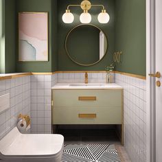 a bathroom with green walls and white tile on the floor, along with a gold framed mirror