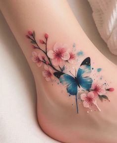 a woman's foot with flowers and butterflies painted on the bottom part of it