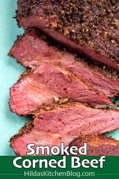 sliced corned beef on a blue plate with the words smoked corned beef over it