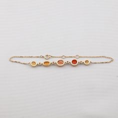 Beautiful Mexican Fire Opal Diamond Bracelet in 18K Yellow Gold. Free Domestic USPS First Class Shipping! Free One Year Limited Warranty! Free Gift Bag or Box with every order! Opal—the queen of gemstones, is one of the most beautiful and rarest gemstones on earth. Every piece of opals has its colors and patterns, which is perfect for designers to create unique engagement rings for someone extra special. We use 100% Natural & Ethically opal stones (NO synthetics or imitations) for our jewelry. - 14k Yellow Gold Bracelet With Gemstone, Multi-stone 14k Yellow Gold Bracelets, Yellow Gold Multi-stone Bracelet Gift, Yellow Gold Gemstone Bracelet In Fine Jewelry Style, Gold Fusion Multi-stone Bracelets, Yellow Gold-plated Gemstone Bracelet, 14k Yellow Gold Multi-stone Bracelets, 14k Yellow Gold Multi-stone Bracelet, Elegant Orange Gemstone Bracelet