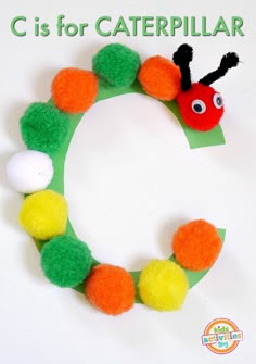 the letter c is for caterpillar craft with pom - poms on it