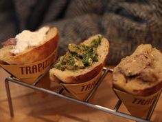 three different types of food in paper cups