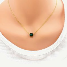 Our Crystal Emerald Cube Birthstone Necklace is an effortlessly gorgeous and minimalist necklace that will become a daily staple. Personalize it with as a birthstone of your loved one, or your own. Whether you are gifting for a thoughtful birthday or baby shower present, this personalized necklace will be loved by the lucky recipient. Made with a Swarovski crystal cube on 14k gold filled chain with a 14k gold lobster clasp to ensure a secure closure. 14k gold chain 14k gold lobster clasp 6 mm Sw Minimalist Gold Emerald Necklace, Minimalist Crystal Necklaces With Round Birthstone Pendant, Minimalist Crystal Necklace With Birthstone Pendant, Minimalist Emerald Necklace With Delicate Chain, Minimalist Crystal Birthstone Necklace With Round Pendant, Minimalist Round Pendant Crystal Necklace With Birthstone, Minimalist Charm Necklace For May Birthstone, Minimalist May Birthstone Necklace With Delicate Chain, Minimalist Necklace With May Birthstone On Delicate Chain