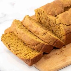 sliced loaf of pumpkin bread on a cutting board