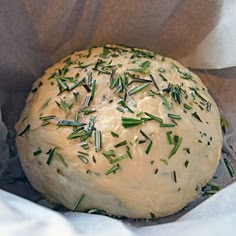 a loaf of bread with sprigs on top