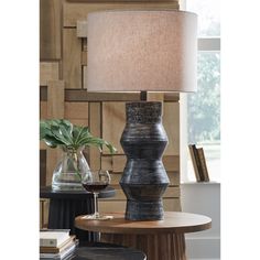 Add a touch of casually cool style to your home with this table lamp. The terra cotta base sports a black rubbed finish that effortlessly complements a wide range of decor and color palettes. Glowing Centerpieces, Terracotta Table, Black Table Lamp, Inner Sanctum, Tall Table Lamps, Tall Table, Fixture Table, Lamp Set, Furniture Market