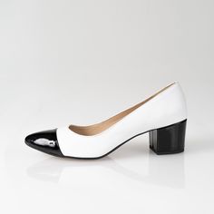 "Milla - beautiful block heels, classic model black & white. The insole made of a soft calfskin ensures comfort of use. Slim sole and delicately pointed toes optically slim feet. Love at first look.... Whatever your style, I can guarantee that pumps will suit your look and add a final touch of polish. The sling-back pumps look just as good with casual jeans, dress or evening outfit. BRAND: Anna Maratti MATERIAL: white grain leather and black patent leather LINING: calf leather SOLE: synthetic FIT: regular width HEELS HEIGHT: 5 cm = 2\" Sizes US, EU, UK and feet dimensions 5 US / 36 EU / 3 UK insoles length 23.5 cm = 9.2 inches 6 US / 37 EU/ 4 UK insoles length 24 cm = 9.5 inches 7 US / 38 EU / 5 UK insoles length 24.5 cm = 9.7 inches 8 US/ 39 EU/ 6 UK insoles length 25.5 cm = 10 inches 9 U Modern White Block Heels For Formal Occasions, Classic Pointed Toe Block Heels With Contrasting Heel Counter, White Block Heels With Contrasting Heel Counter, Chic Pointed Toe Court Shoes With Rubber Heel Cap, White Block Heel Court Shoes For Office, Block Heels With Contrasting Heel Counter And Pointed Toe, Modern Block Heels With Contrasting Heel And Pointed Toe, Modern Court Shoes With Contrasting Heel Counter, Modern White Block Heels With High Heel