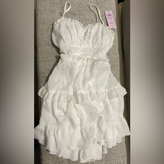 From Target New With Tags. Never Worn White Mini Dress With Ruffled Straps For Date Night, Elegant Mini Dress With Ruffled Straps For Vacation, Feminine Ruffled Sundress For Casual Wear, Elegant White Sundress With Ruffled Straps, White Flowy Midi Dress With Ruffled Straps, Feminine Ruffled Sundress For Party, Elegant Ruffled Sundress For Spring, White Fitted Ruffle Dress For Summer, White Ruffle Dress With Ruffled Straps For Summer