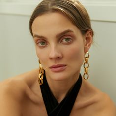 Perfect your look with a pair of luxe gold chain earrings. With their minimalist, eye-cathing design, the delicate and sophisticated Neith Chain Earrings will add an instant touch of glamour to your everyday look.  Handcrafted with 24k Gold plated brass Nickel, lead and cadmium free Earring pins are made of gold plated 925 silver which are non-allergenic Suitable for pierced ears Care To prevent oxidization and maintain long durability, keep your jewelry free of perfume, lotions, and sprays while using. It is advised to remove your gold-plated jewelry before showering. Make sure to store each piece of jewelry in the jewelry case provided or wrapped up in a soft cloth to prevent scratching. It is recommended to gently wipe the surface of your gold-plated jewelry after each use with a non-ab Elegant Gold Plated Linear Earrings For Evening, Chic Gold-tone Earrings For Evening, Gold-tone Drop Earrings With Gold Chain, Yellow Gold Chain Link Earrings, Gold-tone Chain Earrings For Formal Occasions, Modern Gold Plated Earrings For Evening, Elegant Gold Linear Earrings For Evening, Modern Gold Plated Evening Earrings, Chic Gold Plated Linear Earrings For Formal Occasions