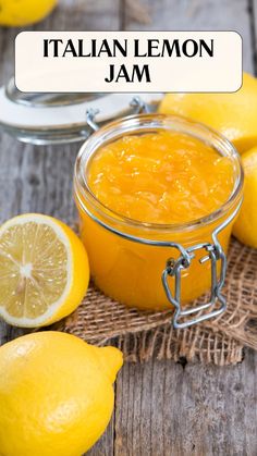 a jar filled with lemon jam sitting on top of a wooden table next to sliced lemons