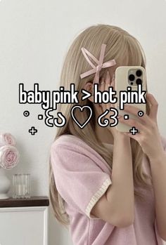 a woman taking a selfie with her phone in front of her face and the text baby pink hot pink