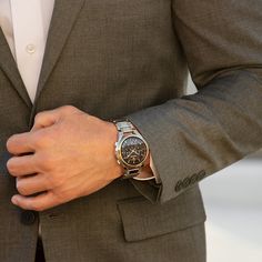 You'll appreciate the modern technology and sleek two-toned details of this men's Bulova Curv chronograph watch with a black dial. The black dial features gold-toned hands and markers, a stripe-patterned design along the face, a trio of chronograph sub-dials and a translucent ring offering a glimpse at the intricate movement beneath. 44.0mm brushed and polished stainless steel case with anti-reflective curved sapphire crystal and a gold-toned ion-plated bezel High precision quartz movement with a frequency of 262kHz - eight times greater than standard quartz - keeps accurate time. The stainless steel link bracelet showcases gold-toned ion-plated accent along the sides and secures with a push-button deployment clasp. Water resistant to 30 meters, this watch includes a 3-year limited manufac Bulova Accutron, Rolex Sea Dweller, Rolex Yacht Master, Rolex Air King, Chronograph Watch Men, Hand Model, Custom Jewelry Design, Watch Gifts, Modern Technology