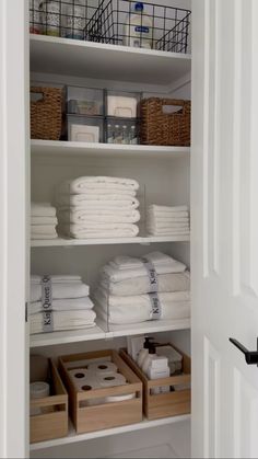 the closet is full of folded towels and other things to use as storage for linens