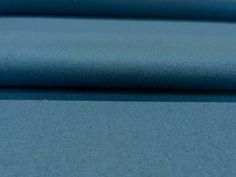 a close up shot of a blue fabric