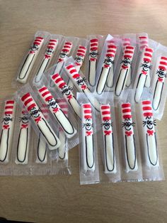 there are many toothbrushes with cat in the hat designs on them, all wrapped in plastic