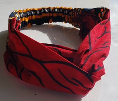 This listing is for Ankara Headbands with a twisted design form. Available in different Ankara design.  The Headband is made from 100% African wax cotton. It has elastic at the back, stretching from 54cm to 68cm Handmade Ships worldwide CARE: Wash with mild soap   Do not bleach Feel free to start up an etsy conversation if you have any questions concerning this outfit Thanks for visiting African Headband, African Hair Accessories, Ankara Design, Back Stretching, Ankara Designs, African Hair, Flattering Tops, African Print Dress, African Wax Print