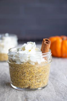 a small glass jar filled with pudding and whipped cream