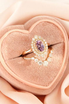 Dive into enchantment with our lavender sapphire engagement ring – a 1.28-carat masterpiece in 14k rose gold, paired flawlessly with a large diamond band. This duo is a symphony of elegance, celebrating love beyond conventions. Break free from the ordinary. 💜💍✨ Lavender Diamond Oval Ring, Lavender Oval Diamond Ring, Lavender Diamond Rings With Halo Setting, Large Diamond Band, Lavender Sapphire Engagement Ring, Sapphire Ring Rose Gold, Lavender Sapphire, Purple Sapphire Ring, Oval Sapphire Ring