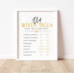 a white framed poster with the words old wives tales written in gold foil on it