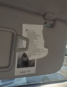 a piece of paper that has been pinned to the back of a car seat