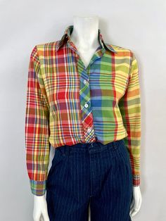 "Vintage 70's Plaid Blouse, Long Sleeve, Butterfly Collar (S) This 70's Blouse comes in a plaid cotton in red, yellow, green, blue and white with white stitching, long sleeves, double wrist button closure, front button closure, and butterfly collar. By Oak Hill. 100% Cotton Made in USA *This blouse is in excellent condition. Size: (S) Modern Day 4 Chest: 36\" Length: 24 1/2\" Sleeve Length: 22 1/2\" (outside shoulder to wrist) 18\" (inside armpit to wrist) Shoulder to Shoulder: 14\" Weight: 6 oz 70s Blouse, Seventies Fashion, Oak Hill, Blouse Long Sleeve, Plaid Blouse, Vintage 70s, Red Yellow, Womens Clothing Tops, Blouses For Women