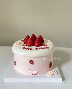 there is a cake with strawberries on it