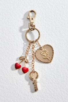 Vintage-style keychain. Gold-tone construction complete with a lobster clasp fastening and hanging pendants. **Content + Care** \- Metal \- Wipe clean | UO Cherry Charm Keyring - Silver at Urban Outfitters Cherry Charm, Sims House, Hanging Pendants, Lobster Clasp, Keychains, Cleaning Wipes, Vintage Style, Urban Outfitters, Gold Tones